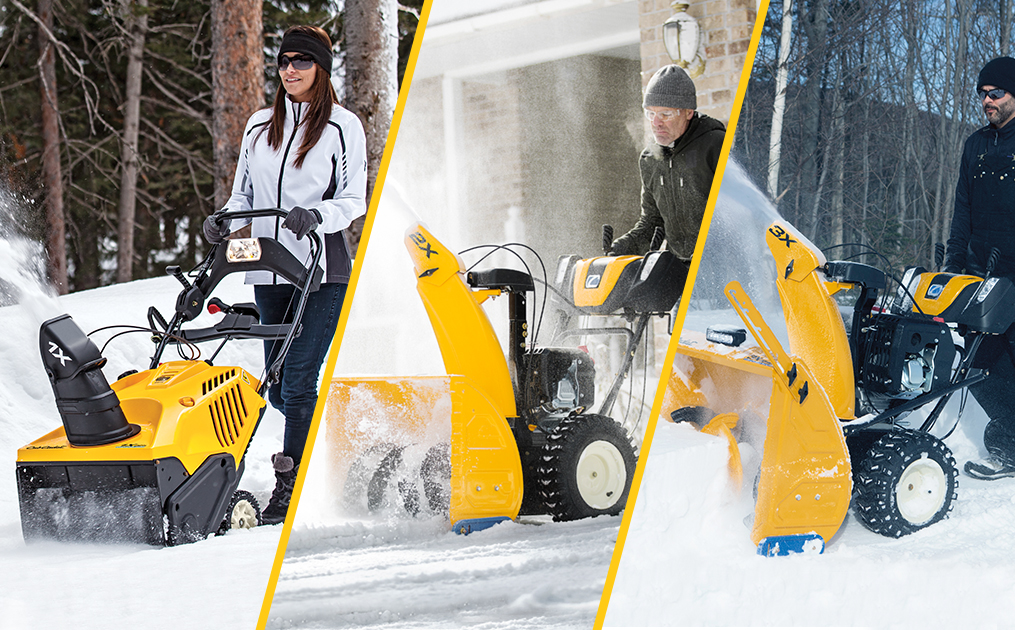 Three Cub Cadet series snow blowers lined up outside on the snow